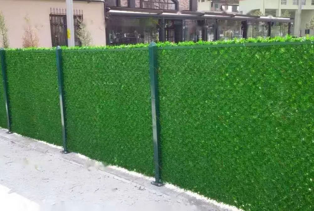 Residential backyard with artificial grass chain link fence